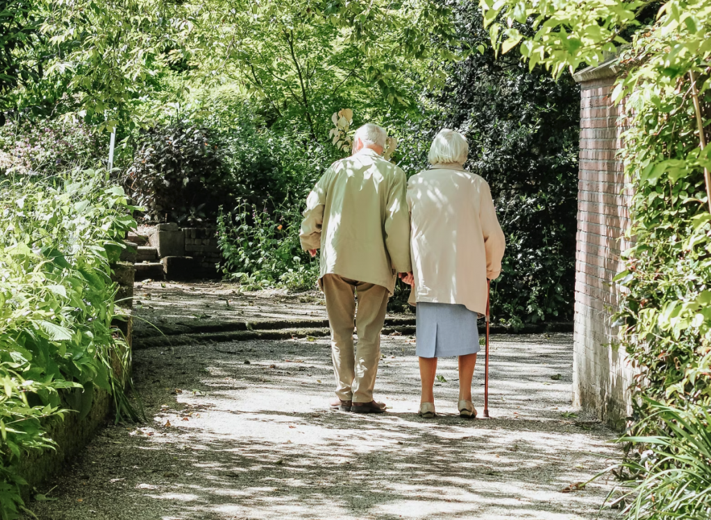 elderly couple walking away