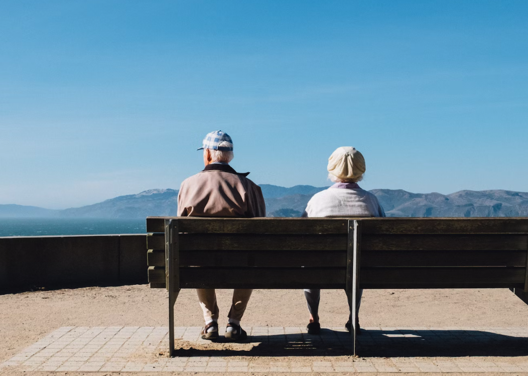 old couple sitting on bench